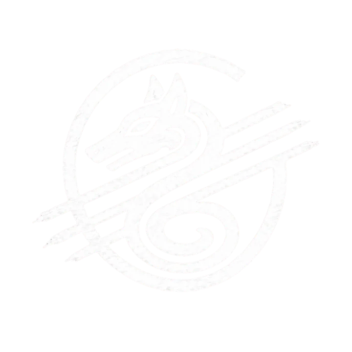 A small dark metal disk, worn smooth at the rim, engraved with a wolf-like creature whose body curves into a serpent's tail.